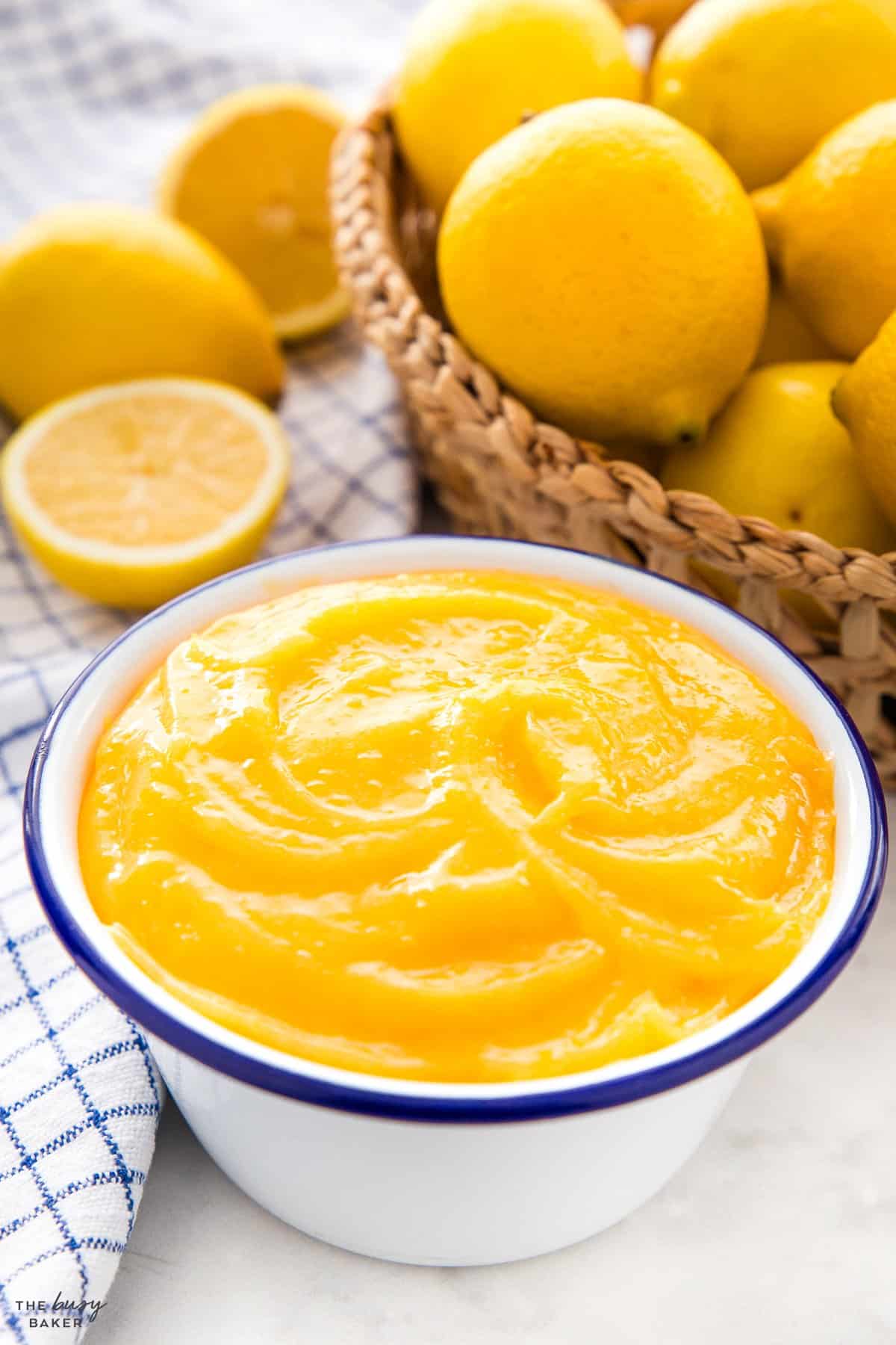 lemon curd in a white bowl with a blue rim