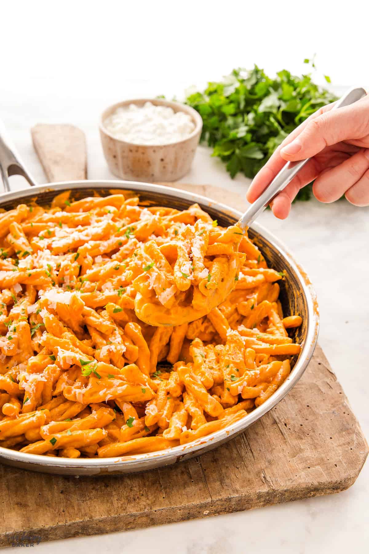 hand serving protein pasta