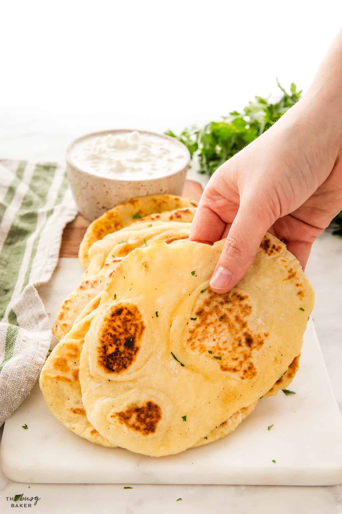 hand holding pan fried cottage cheese flatbread
