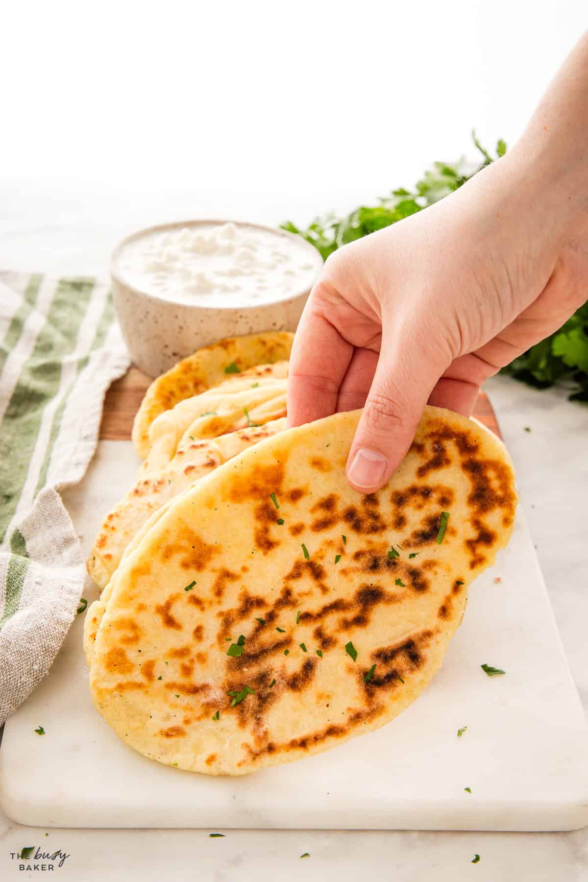 hand holding a cottage cheese flatbread