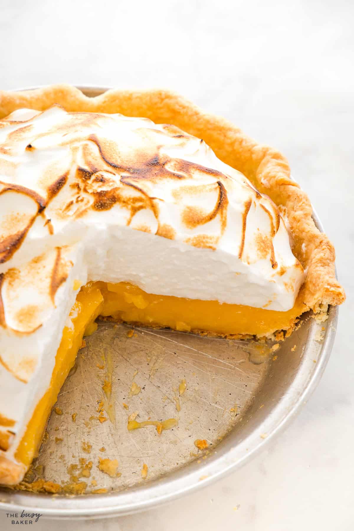 lemon meringue pie in an aluminum pie plate