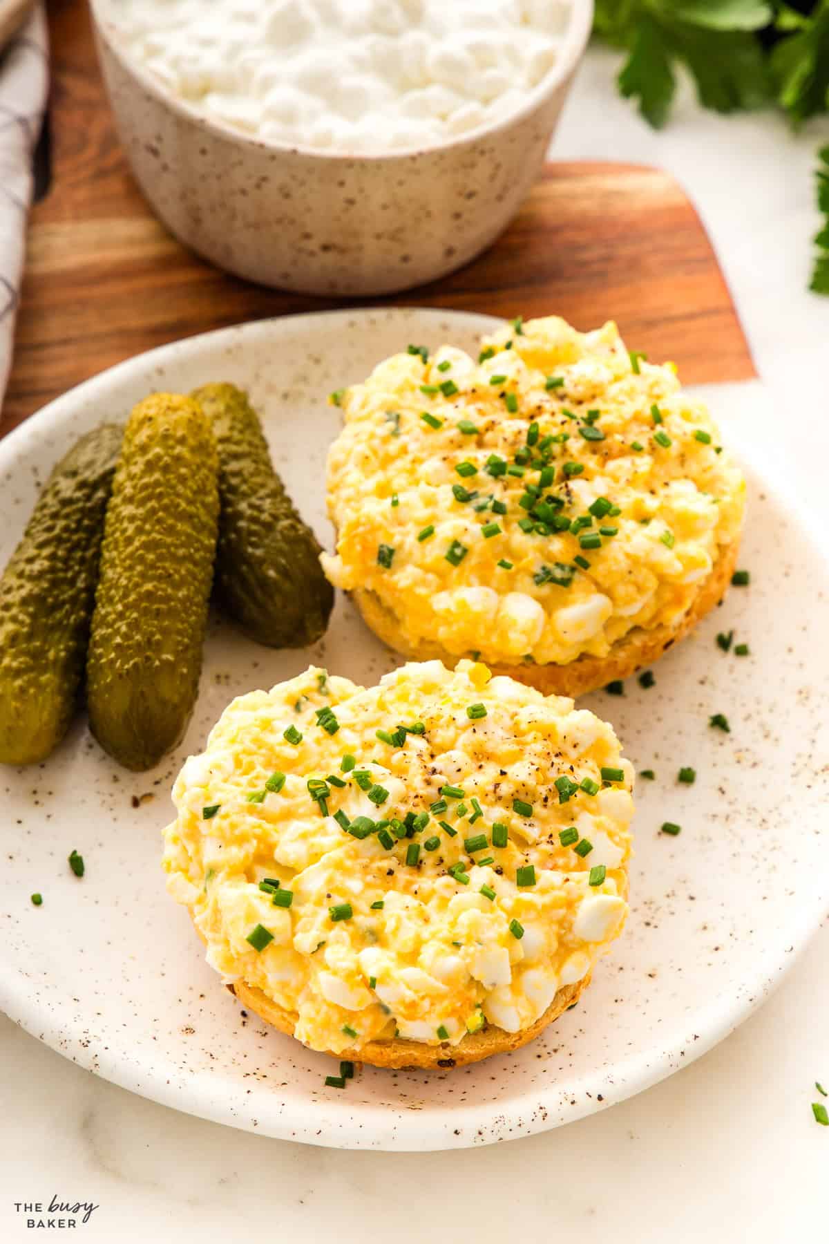 protein egg salad on bagels with chives and pickles