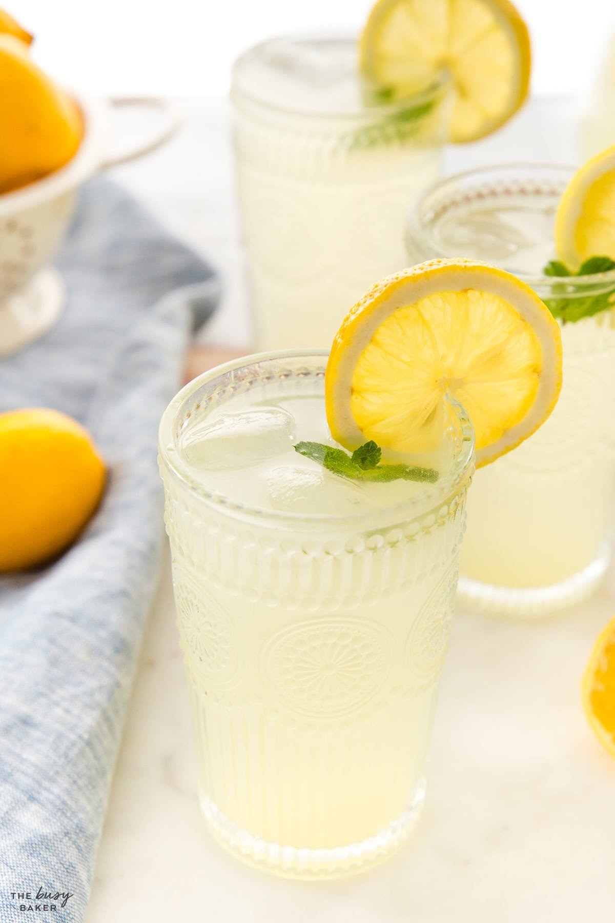 glass of lemonade with a lemon wedge