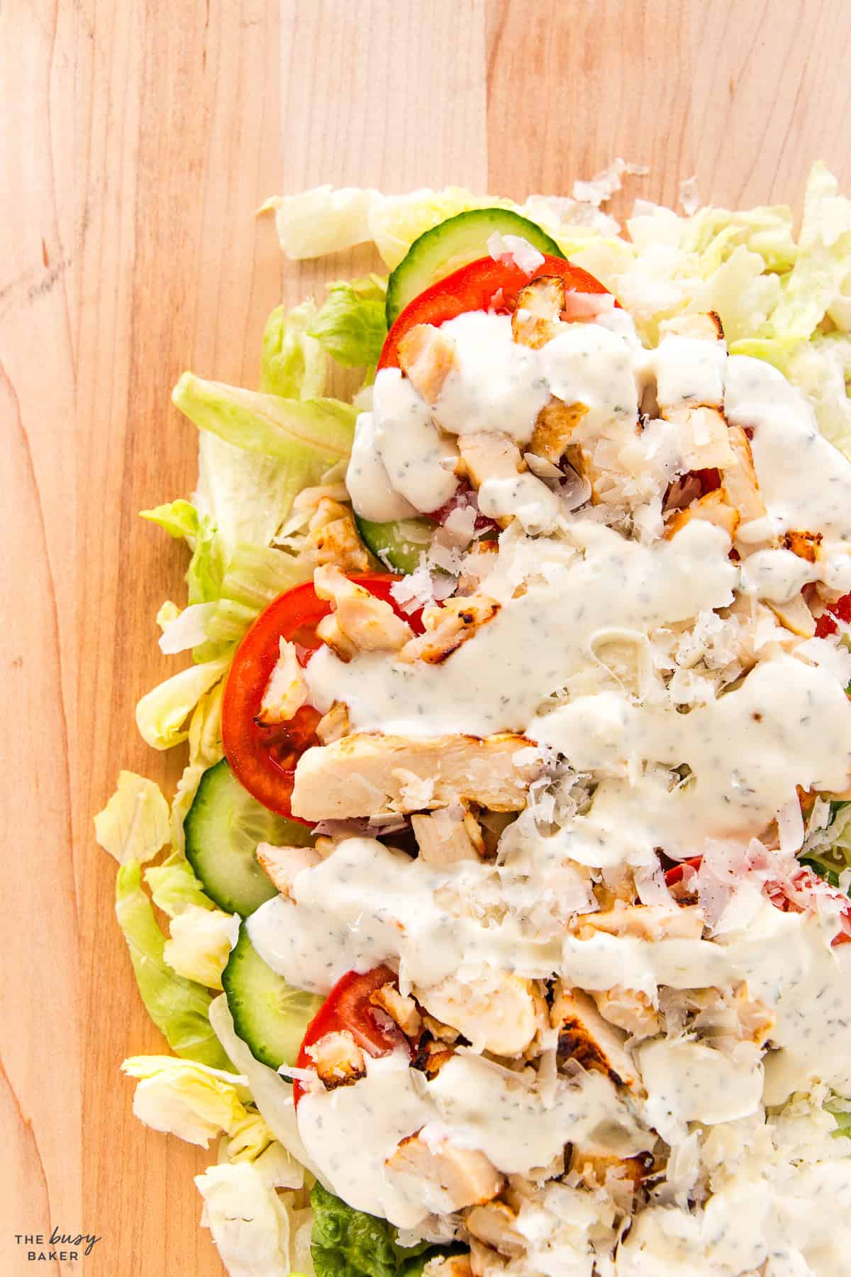 chicken salad with dressing on a cutting board