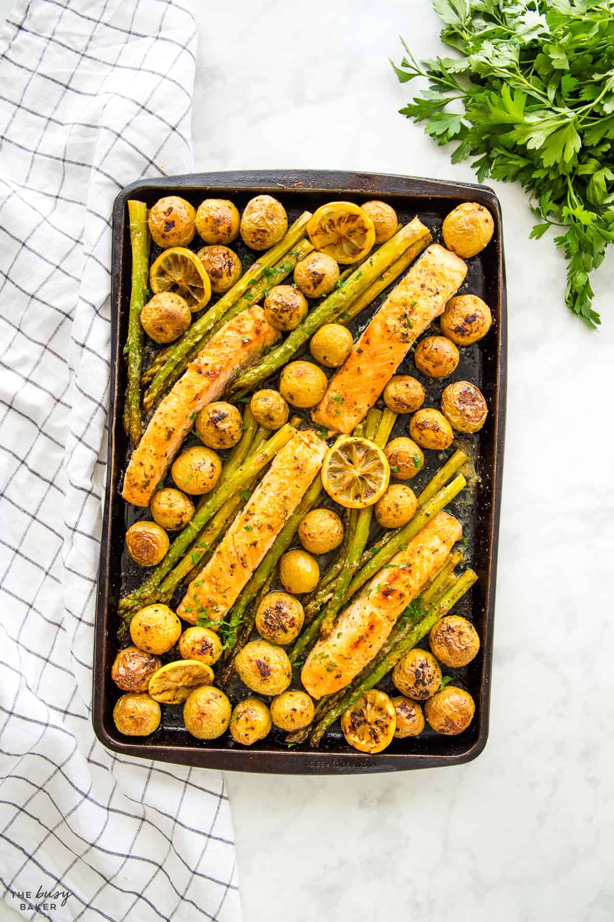overhead image: baked salmon with potatoes and asparagus