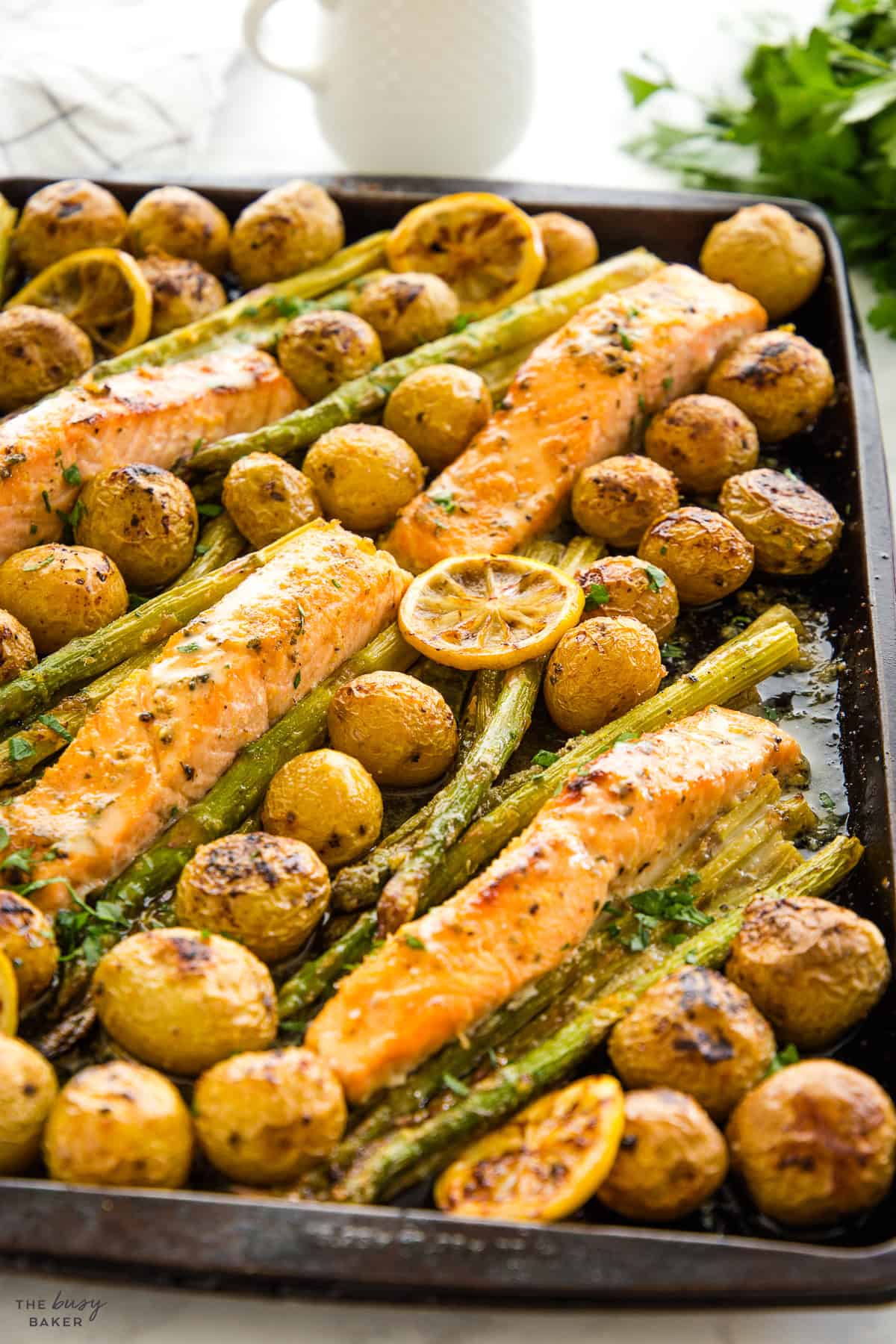 Fish, potatoes. andasparagus on a sheet pan
