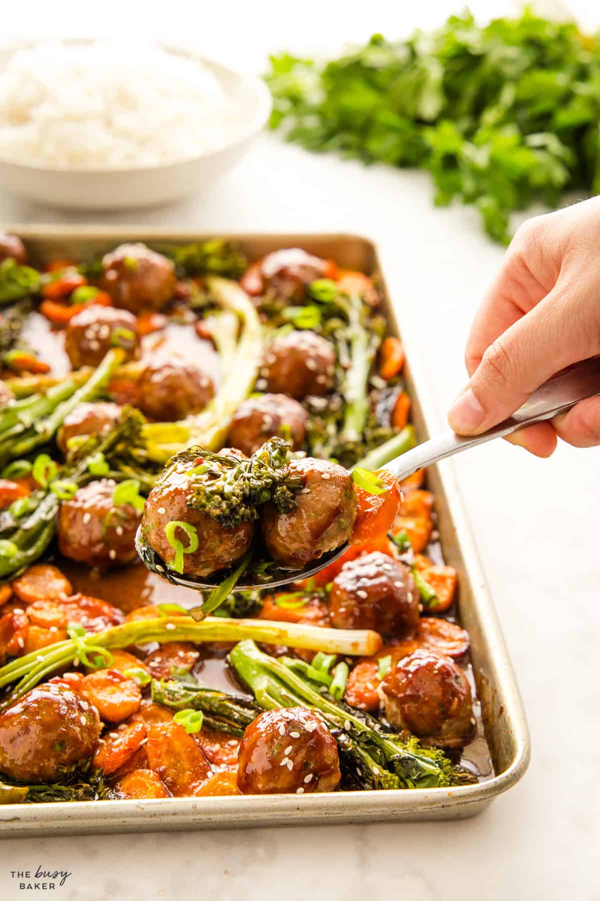 spoonful of meatballs with broccolini