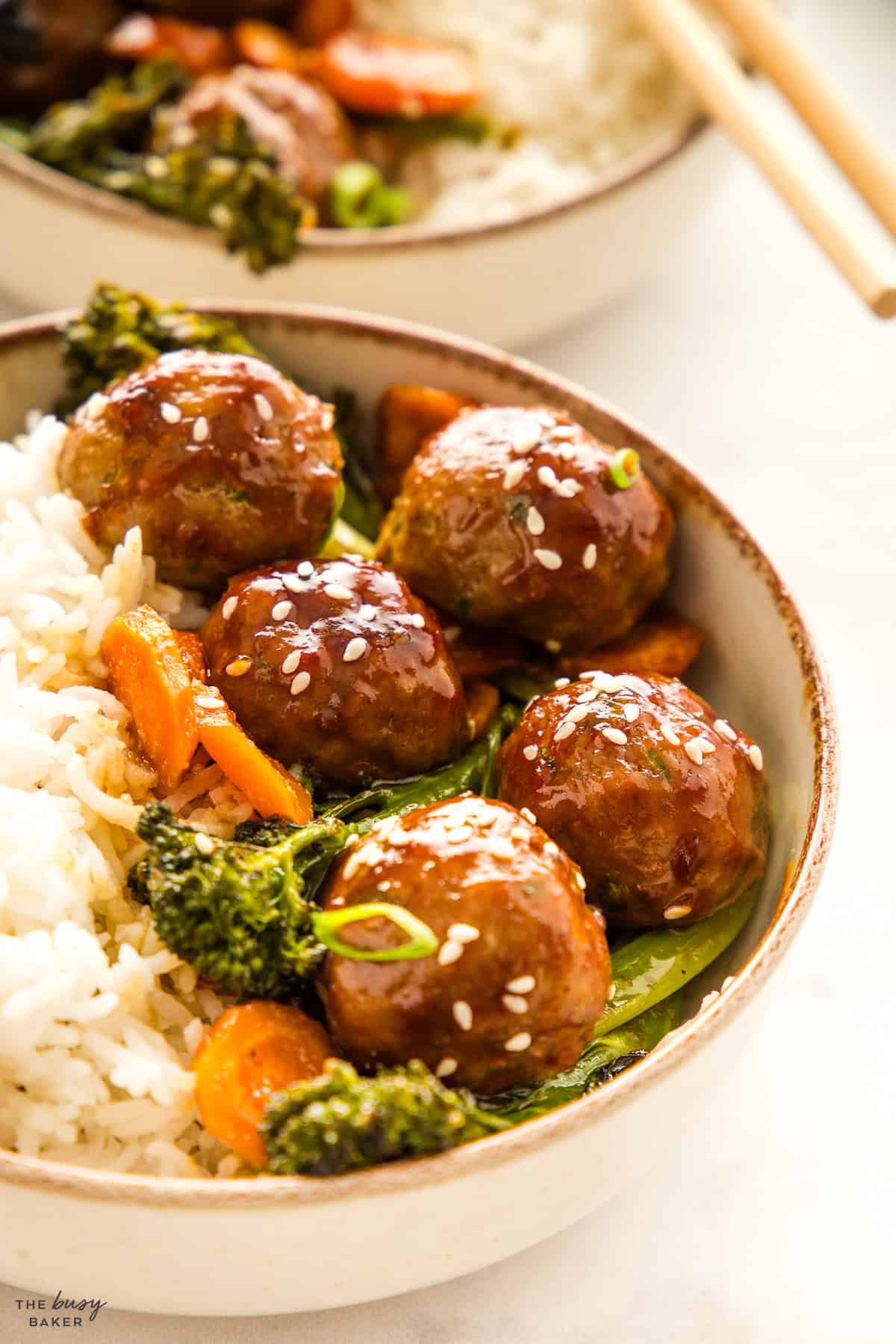Asian meatballs and veggies in a bowl with rice