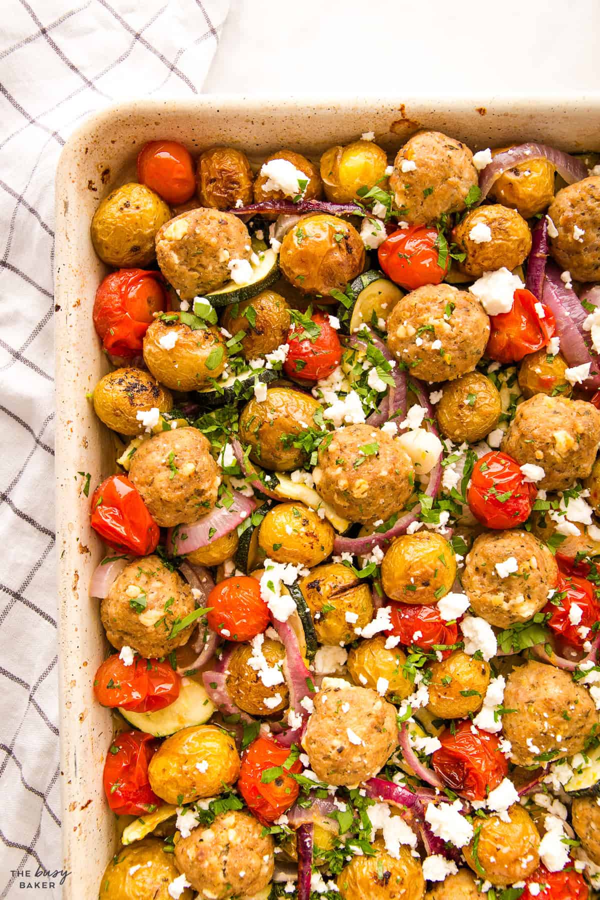 sheet pan dinner with meatballs and potatoes and veggies
