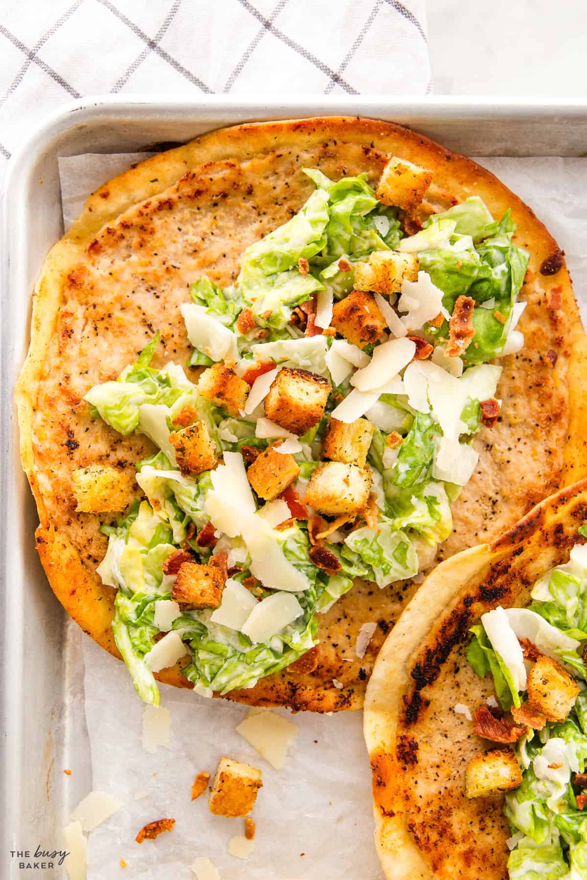 closeup image, chicken caesar salad on a taco