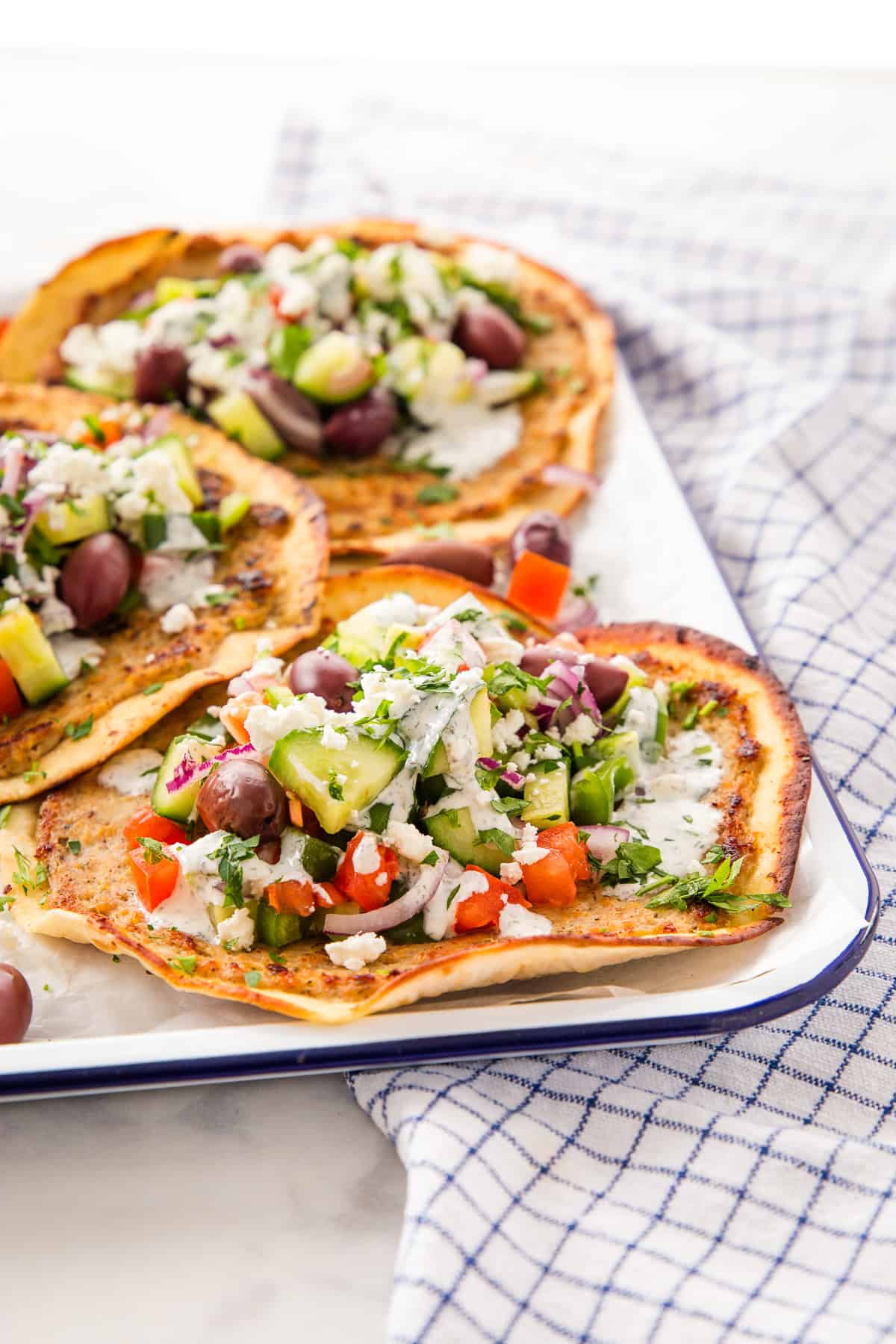 crispy Greek smash tacos on a platter