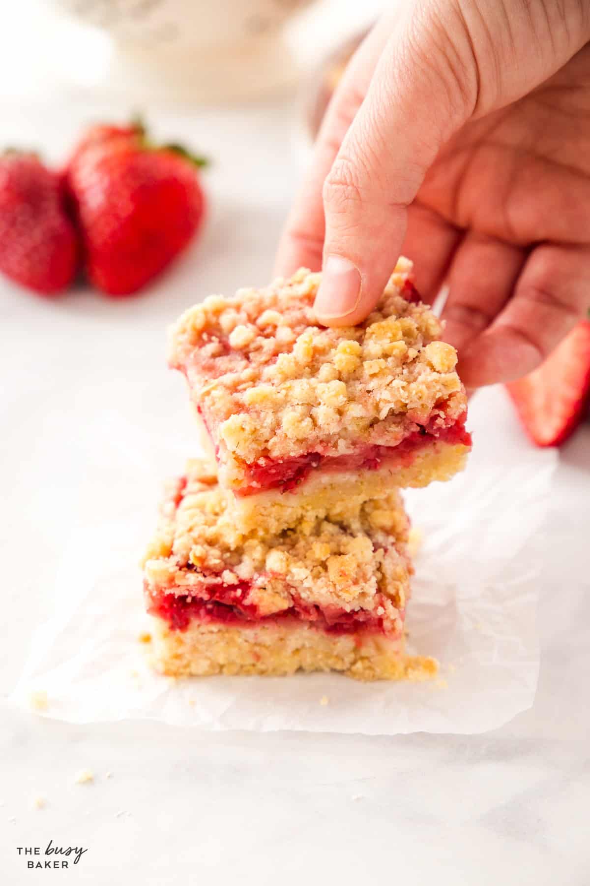 hand holding strawberry oat bars 