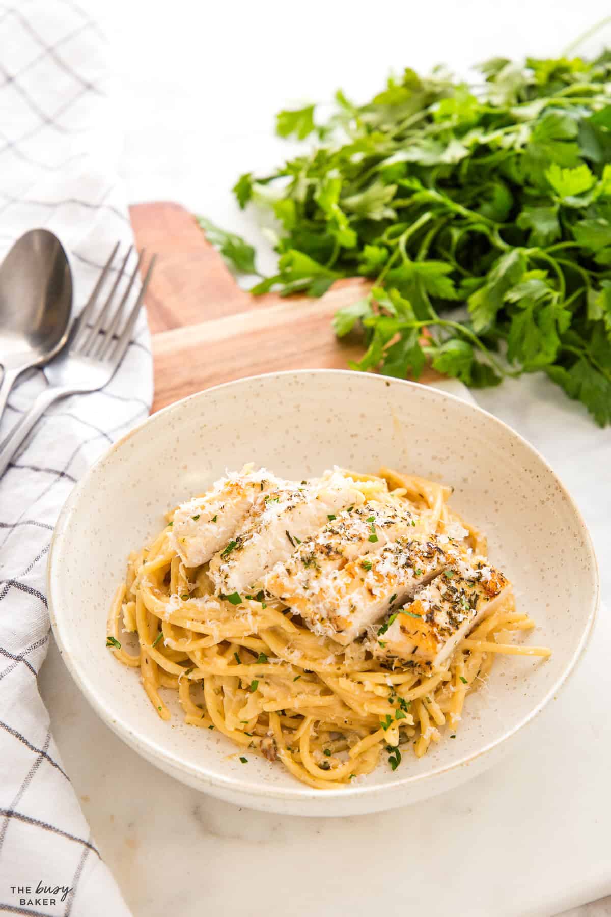 bowl of spaghetti with garlic parmesan sauce and chicken breast