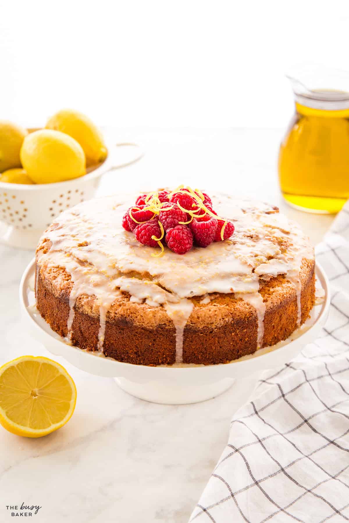rustic dessert on a white cake stand with berries