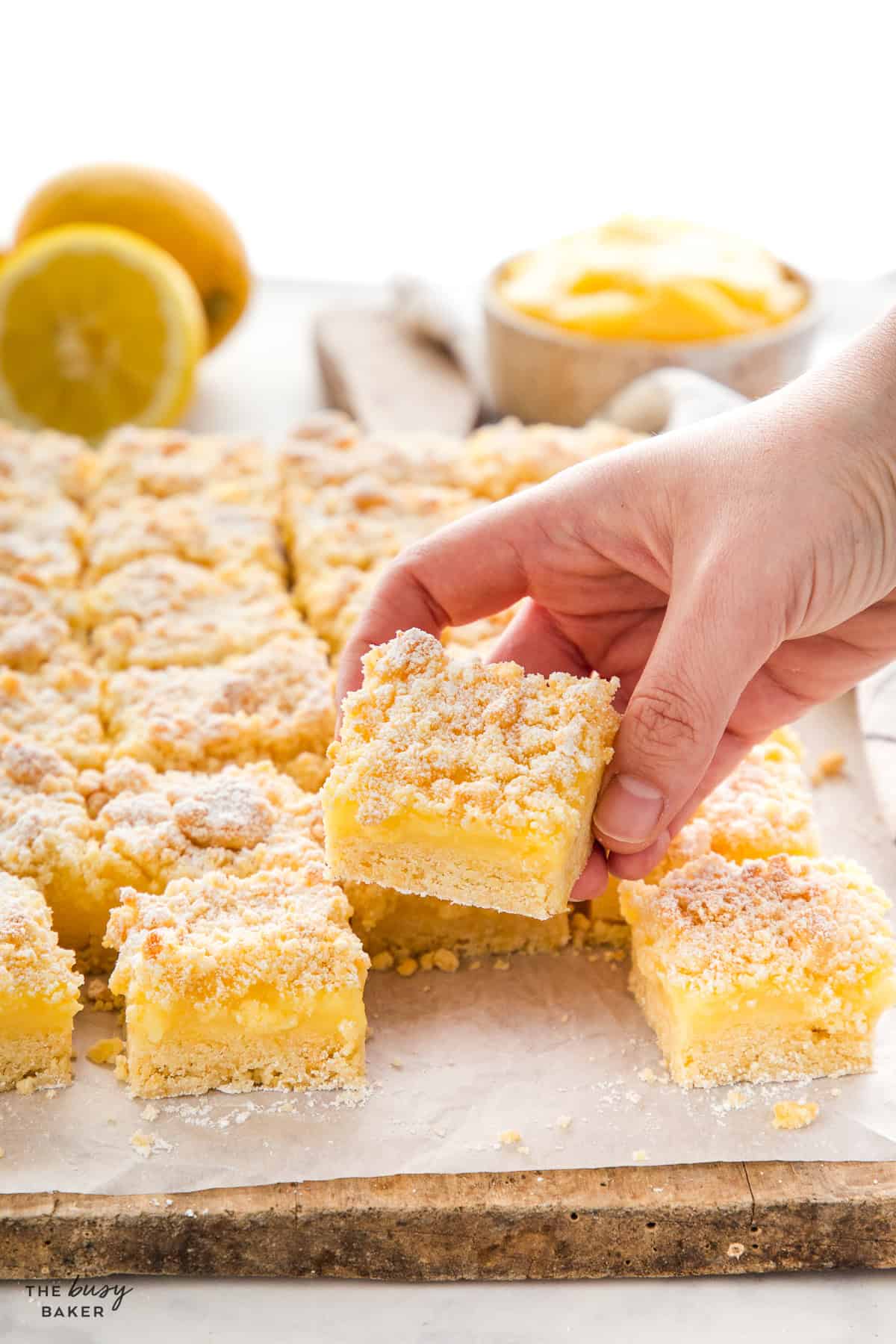 hand holding a lemon bar