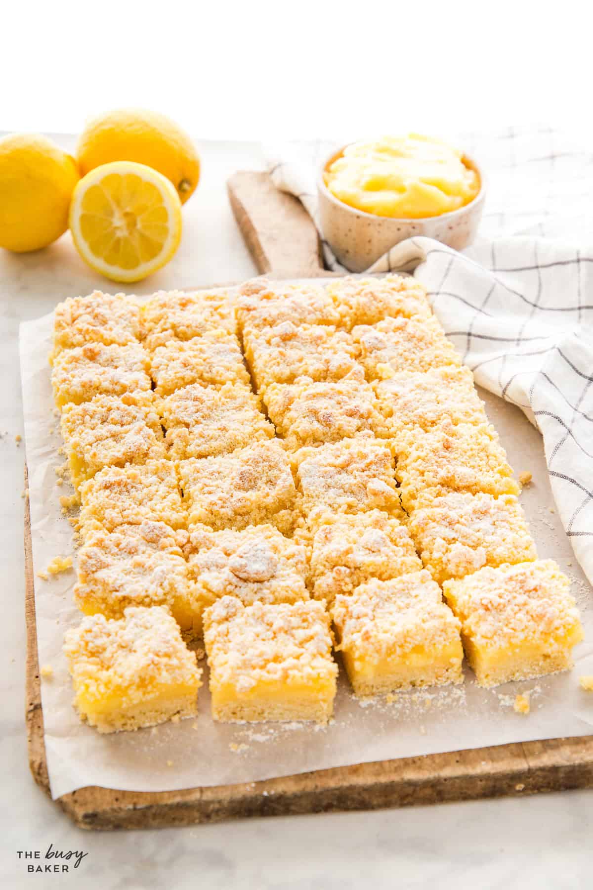 sliced lemon crumb bars on a cutting board