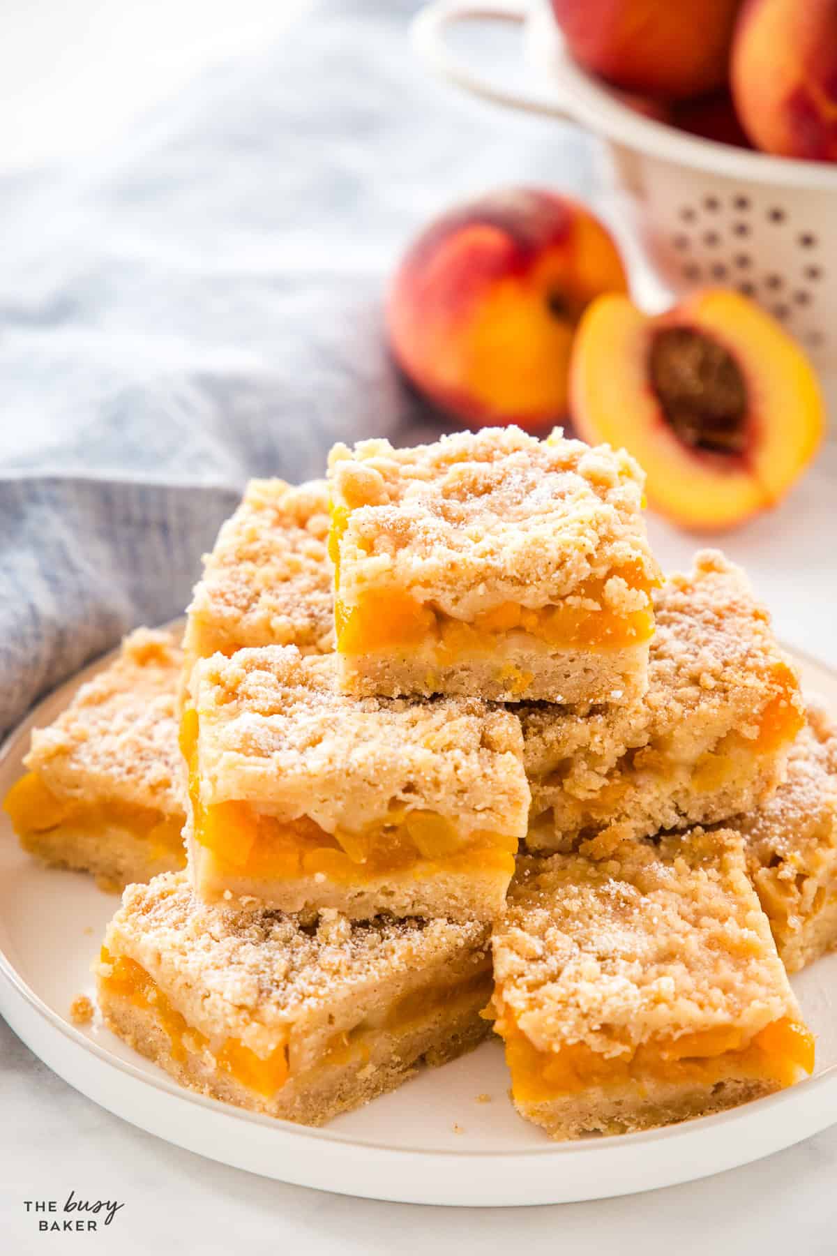 peach crumb bars on a white plate