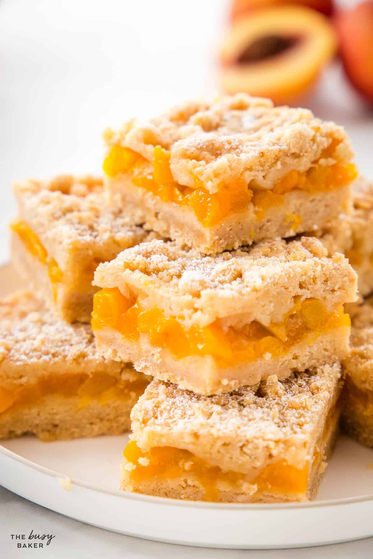 peach crumb bars sliced on a plate