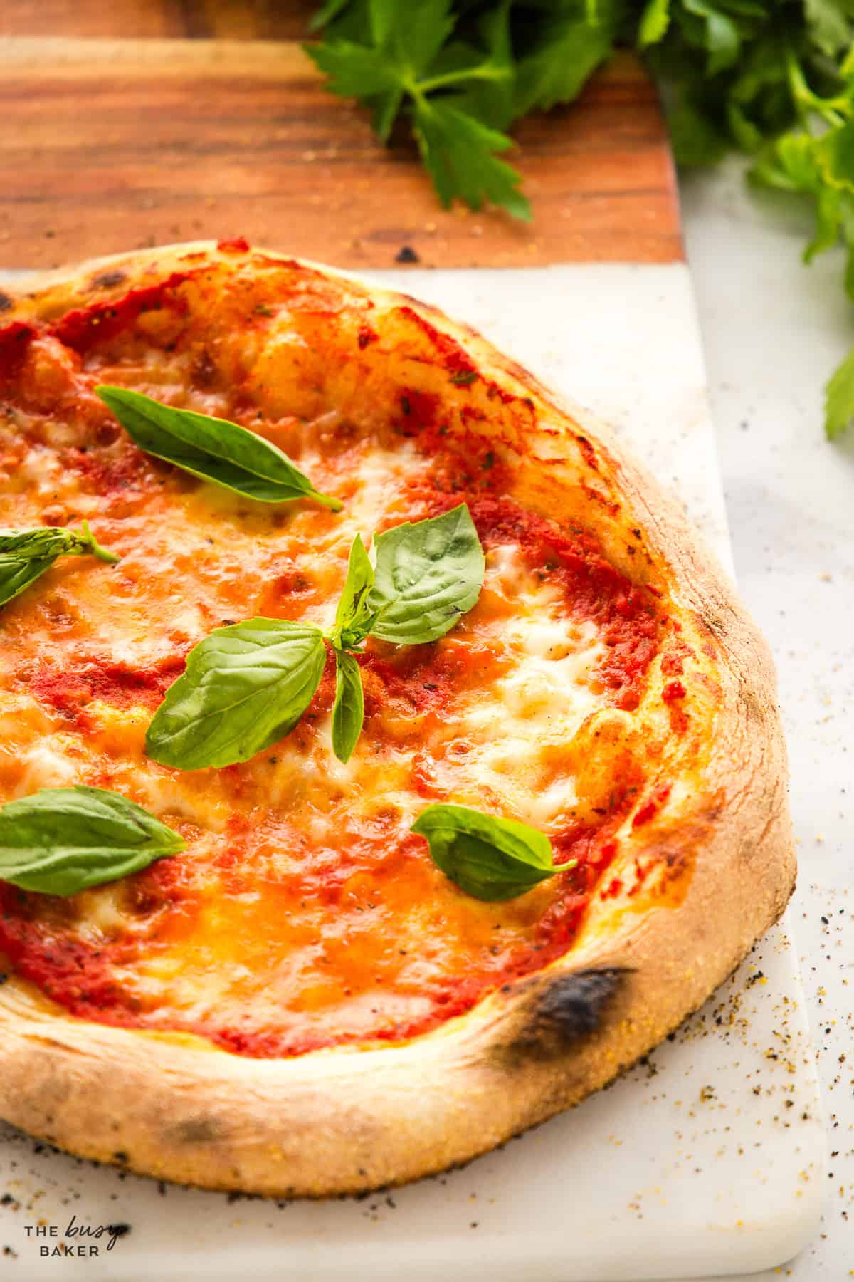 a wood fired pizza with the BEST pizza sauce and fresh basil