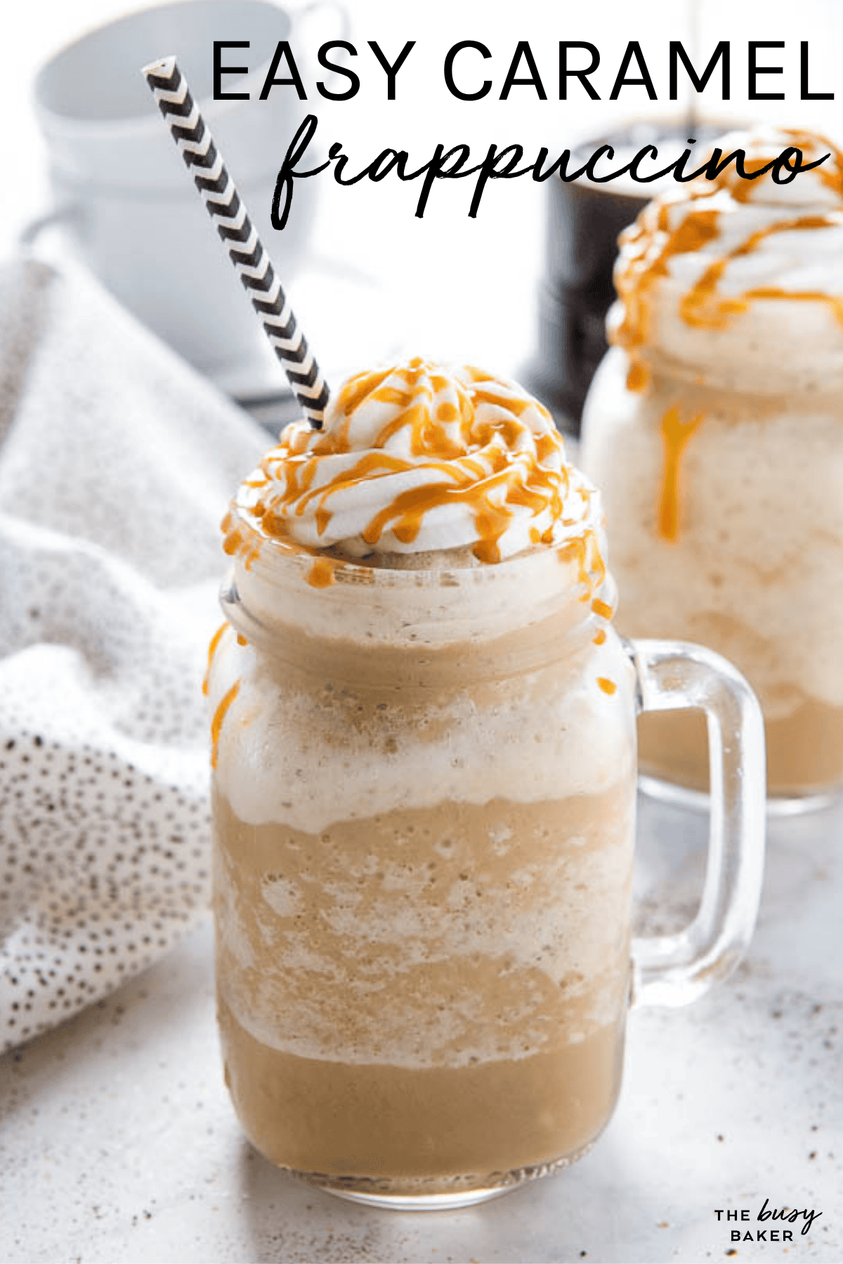 easy homemade caramel frappuccino in a glass mug with whipped cream and caramel sauce